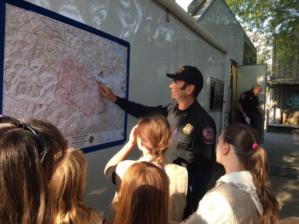 A public relations officer shows the Cadets a map of the Chimney fire area. Photo contributed by Christy Little.