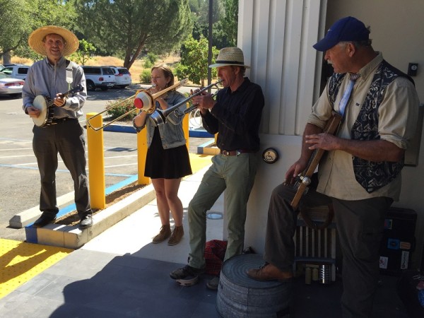 Ragbone Saints played their toe-tapping music outside the Atascadero Library Saturday then marched through the anniversary celebration inside.  Photo by Paula McCambridge