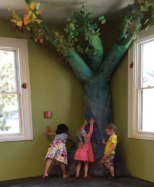 Children immediately ran to the thick, soft, felt tree created by artist Lauren Birkhahn.   Photo by Paula McCambridge