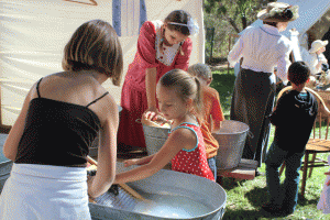 Attendees got to experience what it's like to wash laundry by hand with a wash board. Photo by Heather Young