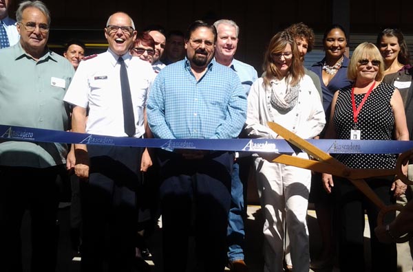 Left to Right: Mayor Tom O'Malley, Major Ian Robinson, Joe Modica Jr., Vicky Terhune, Beth Quaintance. Sharon West cut the ribbon. Photo by Teresa Turner.