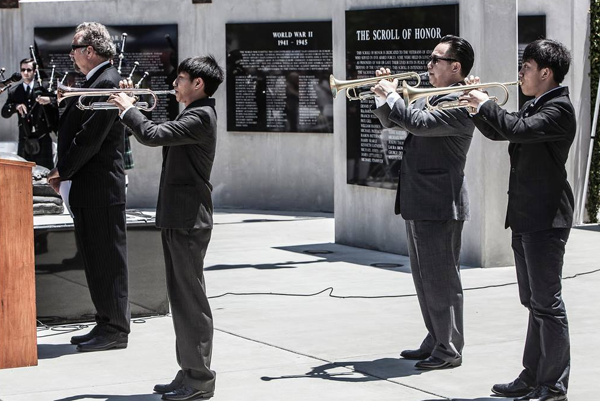 County Clerk Recorder Tommy Gong and his two sons performed TAPS.