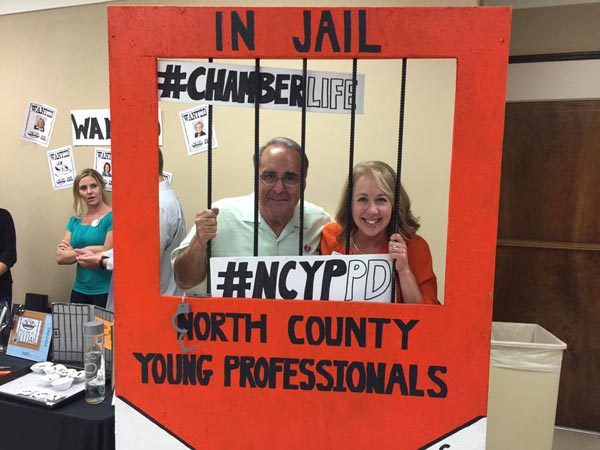 Councilwoman Heather Moreno and Mayor Tom OMalley in North County Young Professionals' "Jail" themed booth. 