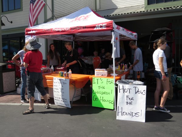 Miner's was kind enough to have set up an awning and tables for the team to keep cool while they worked hard selling hot dogs.