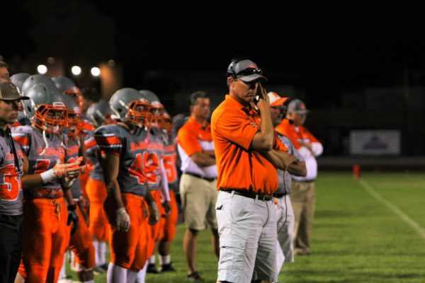 Coach Justin Fisher plans out tactics for his team in wht would prove to be a challenging game.