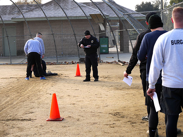 Recruits line up to drag a 165-lb dummy some 20 feet.