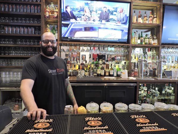 Street Side Ale House bartender Adam Afriade manning the bar. 