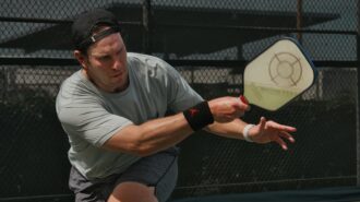 A man plays pickleball