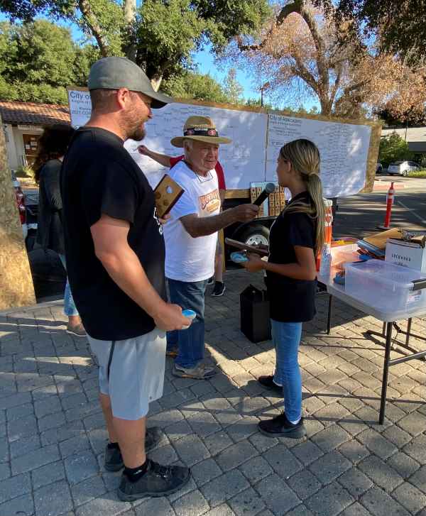 Mike Lopicolo interviewing 3rd place finishers Emily Fortin and her dad, Bryan Fortin