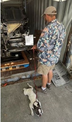 Printery Greg Ravatt admires equipment while Moonshine relaes