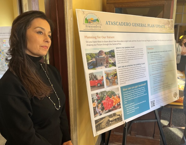 Jewelry designer Angela Cisneros listens to residents remarks