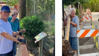 Kiwanis volunteers help replace fence at Charles Paddock Zoo