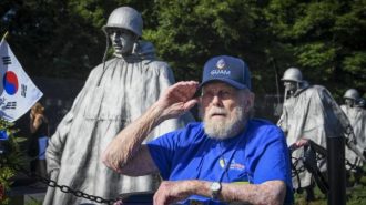 A veteran salutes at the Korean War Veterans Memorial in Washington, D.C.