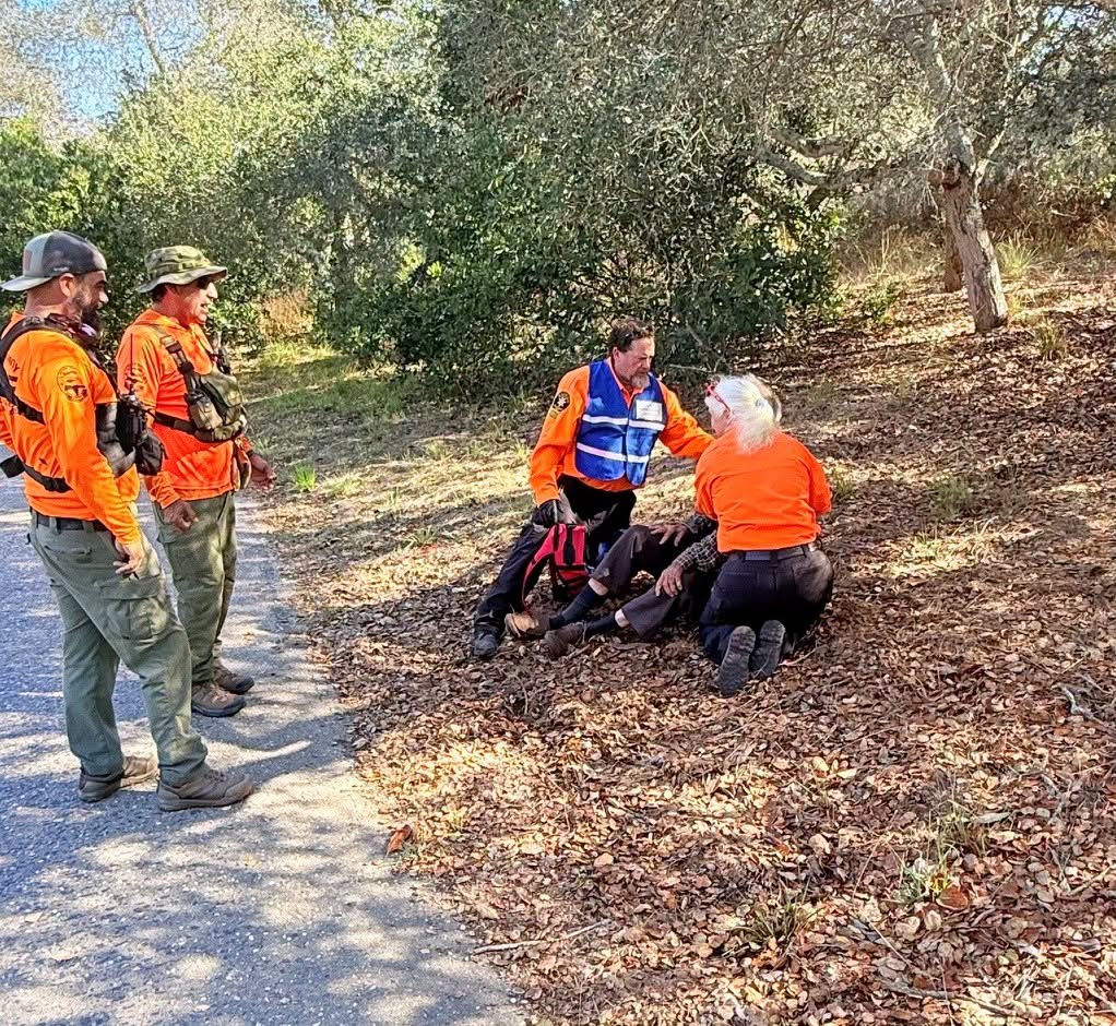 Search and Rescue volunteers tend to Michael Inglis after he was found